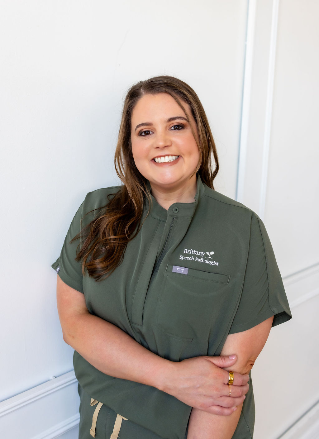 Portrait of Brittany Shockley in green scrubs