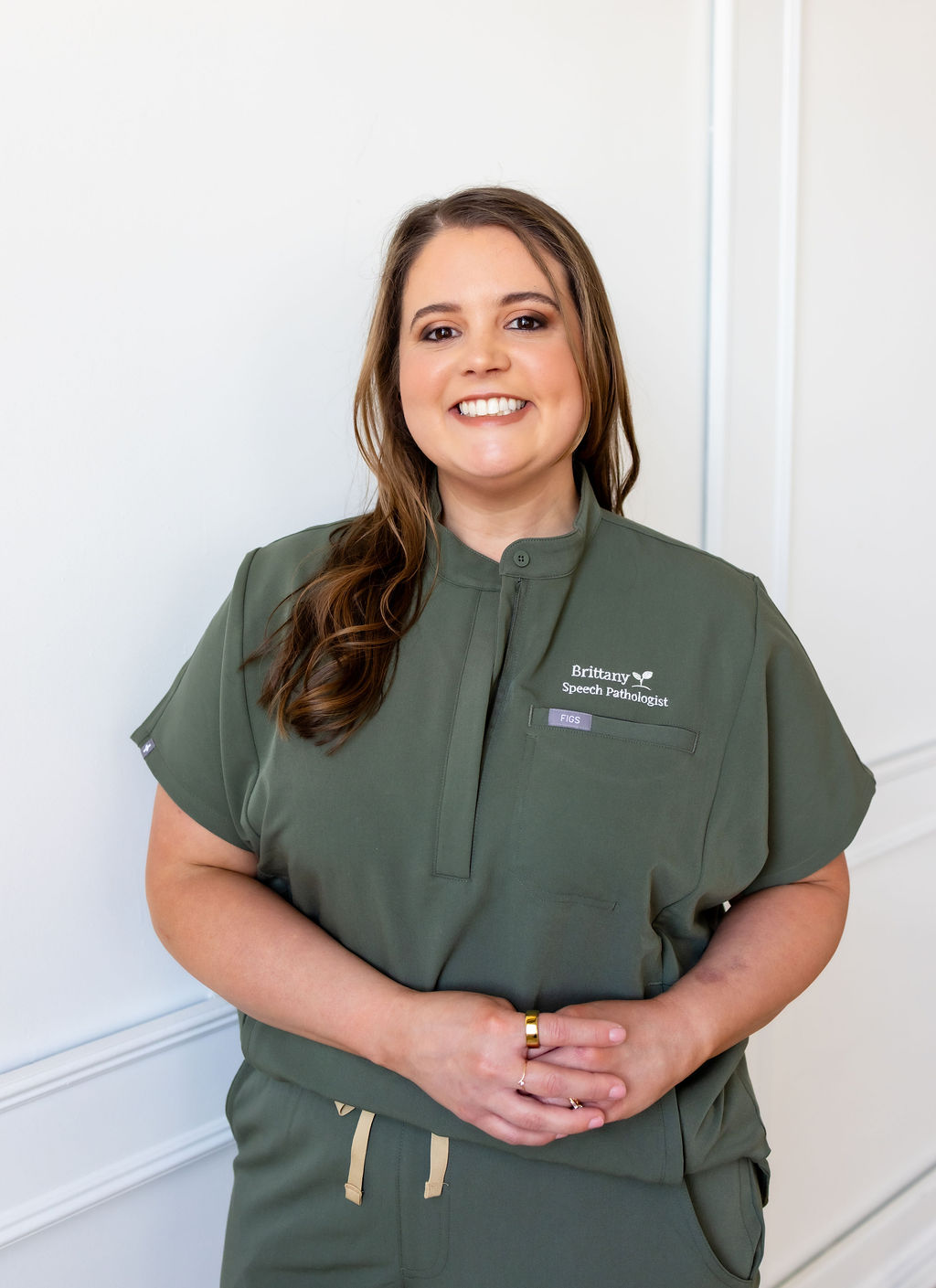 Portrait of Brittany Shockley in green scrubs