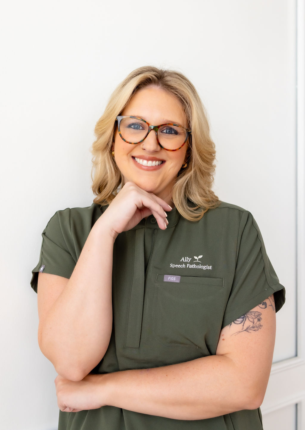 Portrait of Ally Gore in green scrubs
